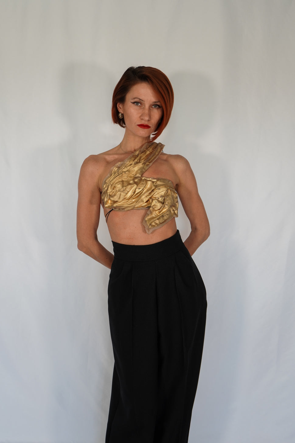 Golden one shoulder wet look corset