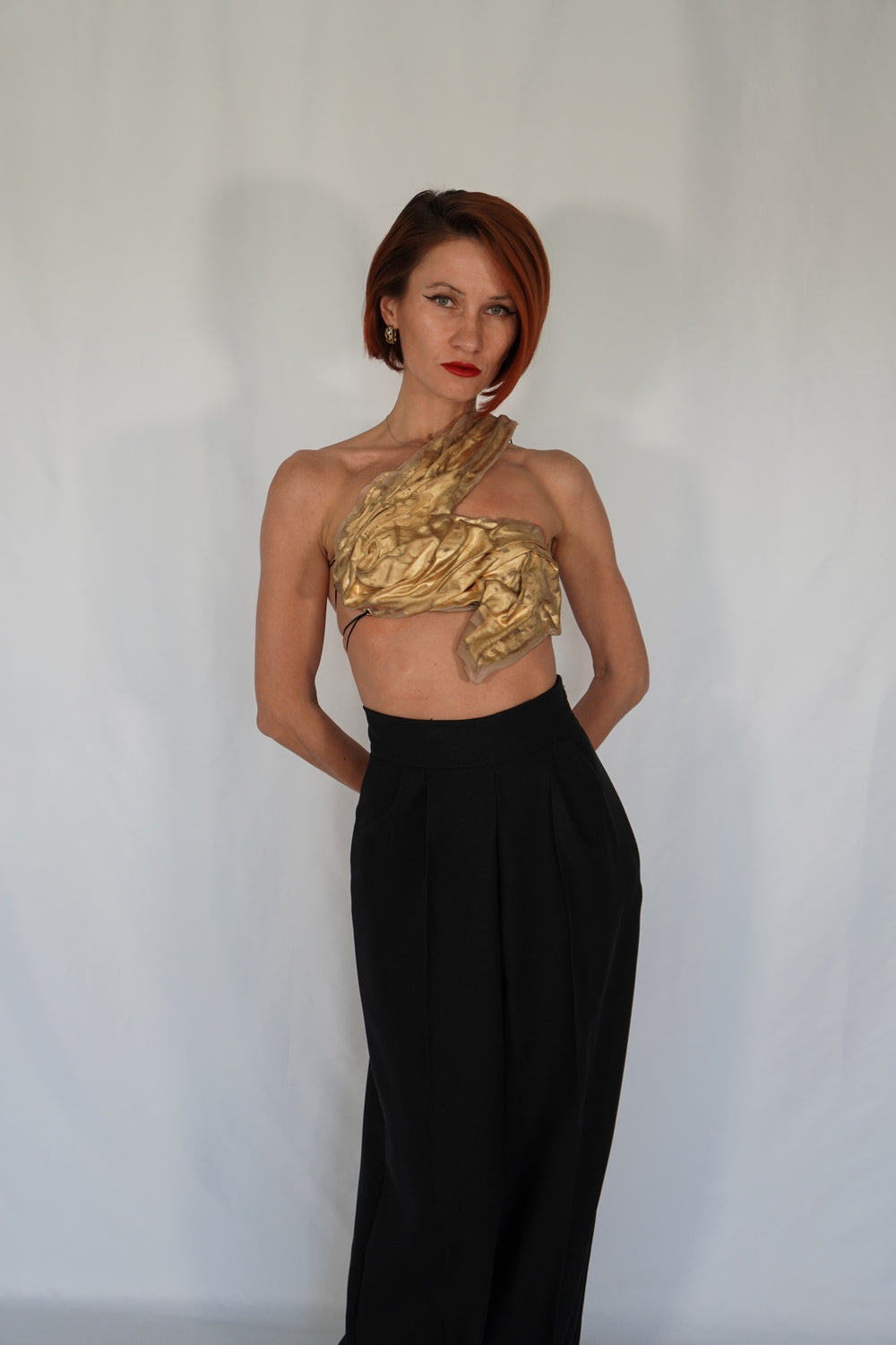 Golden one shoulder wet look corset