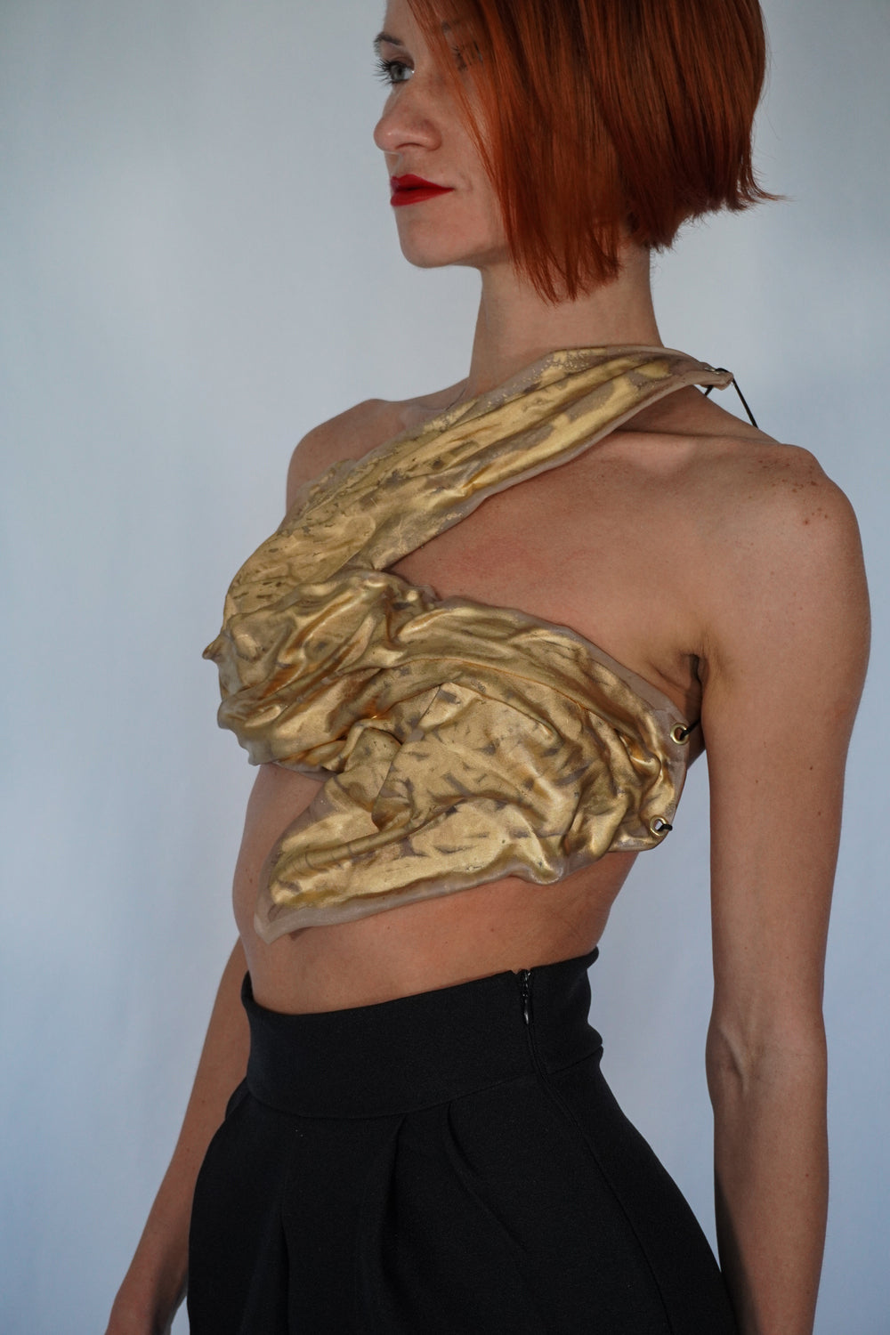 Golden one shoulder wet look corset